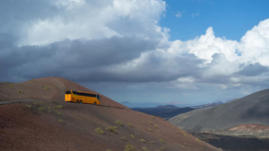 Tour bus in the National park Timanfaya, Lanzarote Island, Canary Islands
